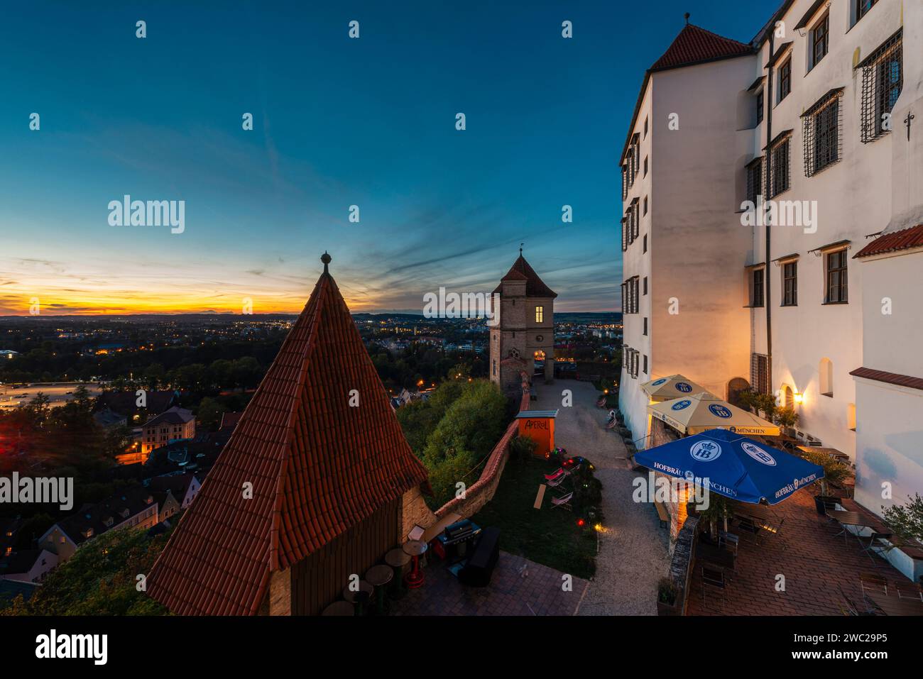 Sunset on the terrace of the restaurant at Trausnitz Castle with a panoramic view of Landshut and the Isar valley, Bavaria, Germany Stock Photo