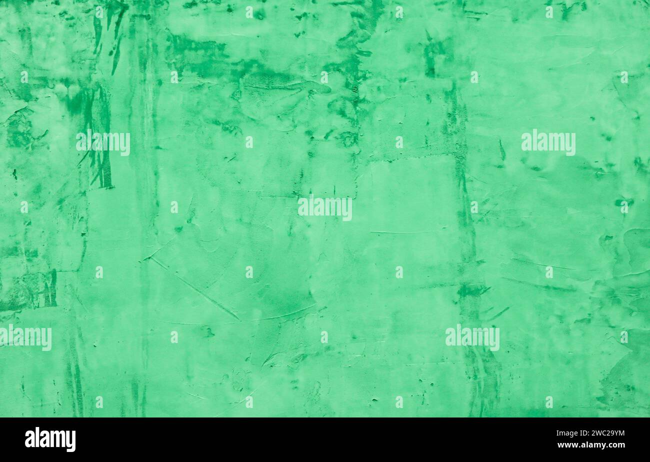 Cement wall painted with green paint. Stock Photo