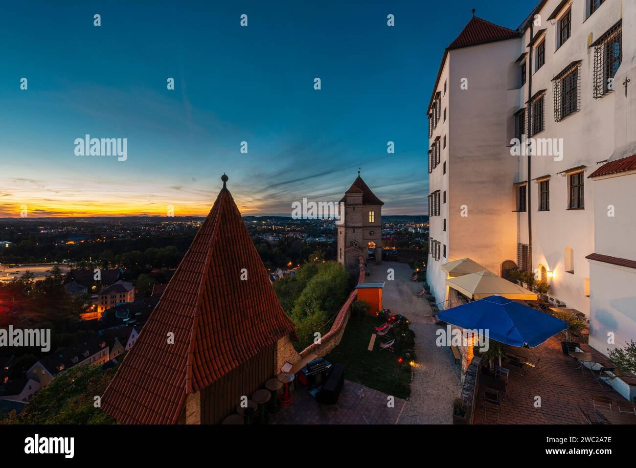 Sunset on the terrace of the restaurant at Trausnitz Castle with a panoramic view of Landshut and the Isar valley, Bavaria, Germany Stock Photo