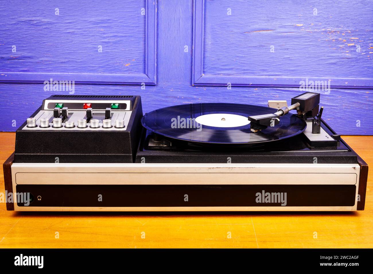 Vintage turntable vinyl record player with black vinyl on a table Stock ...