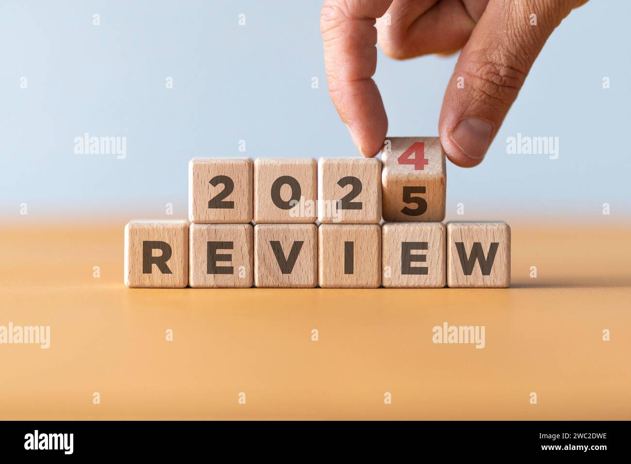 2023 business and customer review for business strategic planning in the next year 2024. Flipping of 2023 to 2024 on wooden blocks. End of the year Stock Photo