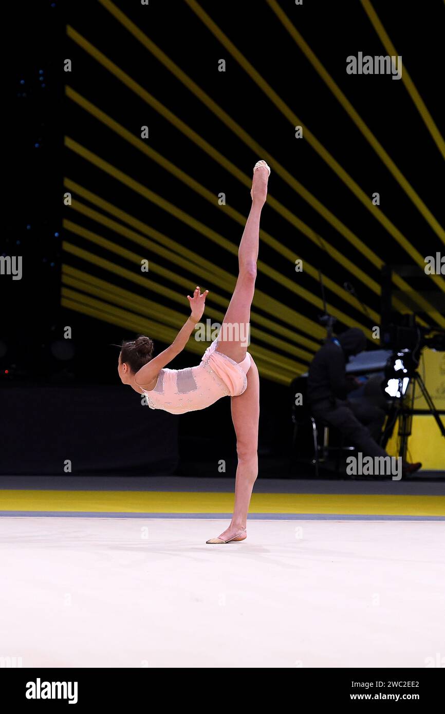 gymnast girl perform at rhythmic gymnastics competition Stock Photo