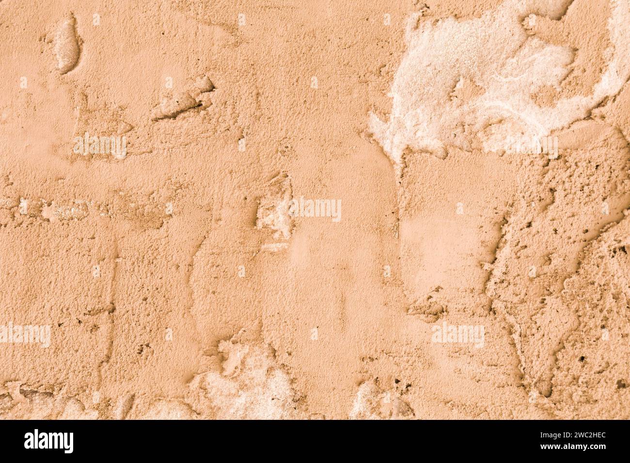 Rough plaster wall Brown with obvious divorces on the surface. Stock Photo