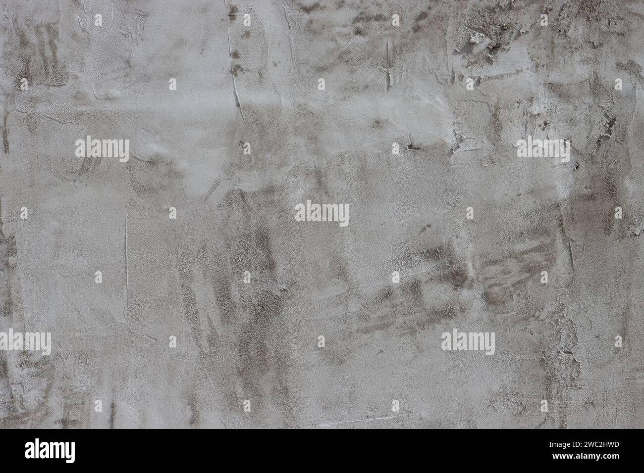 Cement wall covered with plaster. Stock Photo