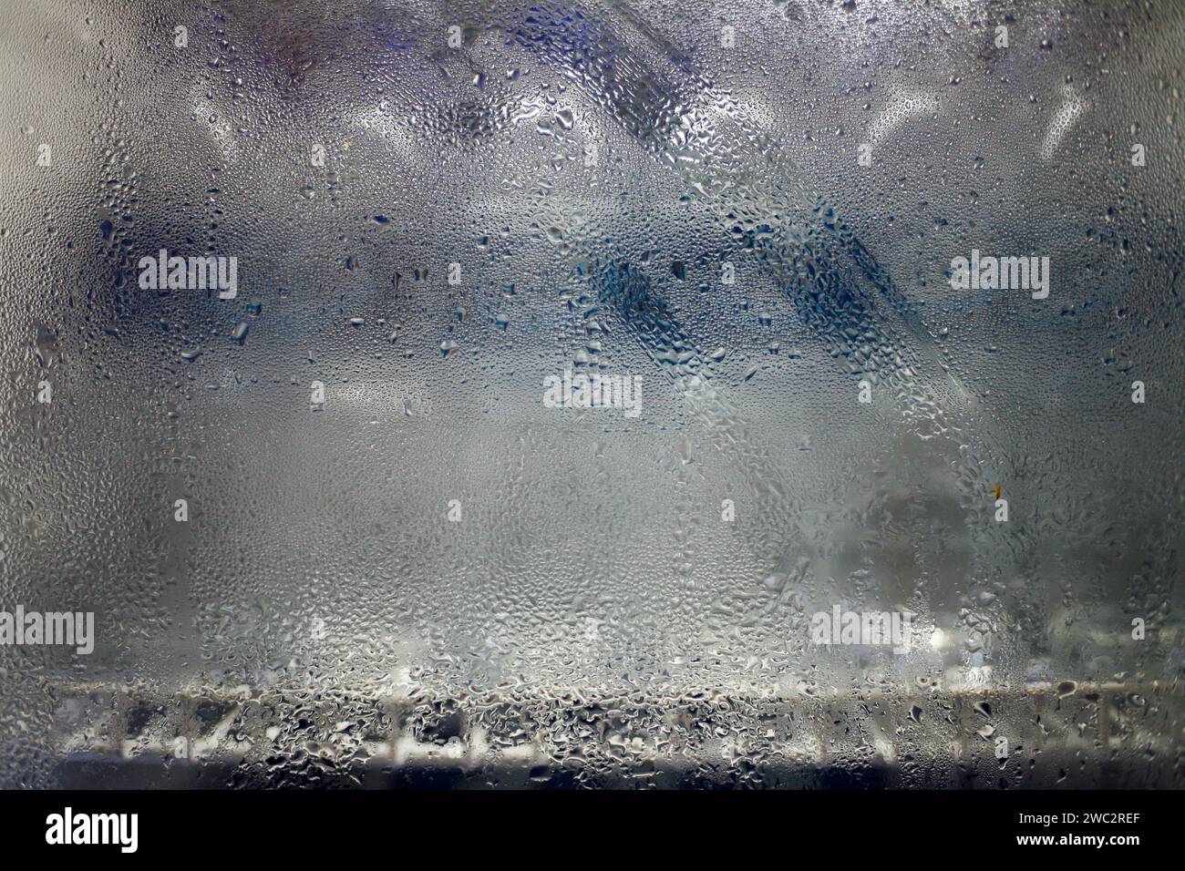 Close up of water condensation in refrigator glass. Cold Frosted glass fridge Stock Photo