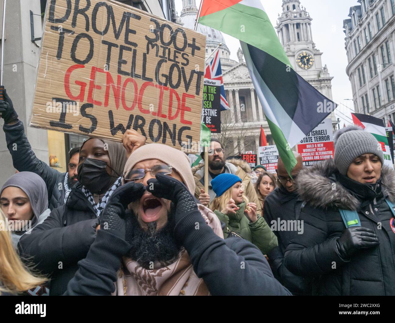 London, UK. 13 Jan 2024. A man shouts. Hundreds of thousands march in ...