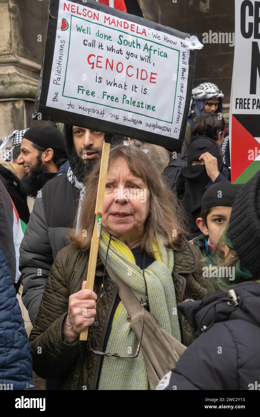 London, UK. 13 Jan 2024. A woman holds a placard 'Well Done South