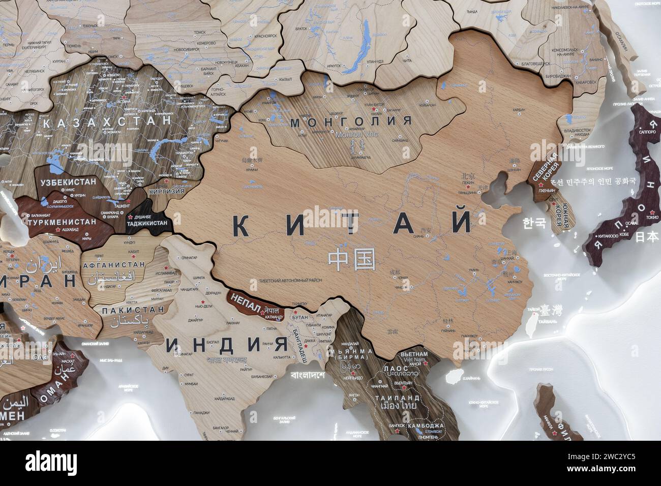 Wooden map of China and neighboring countries, names of countries in Russian. Map for trip planning. Stock Photo