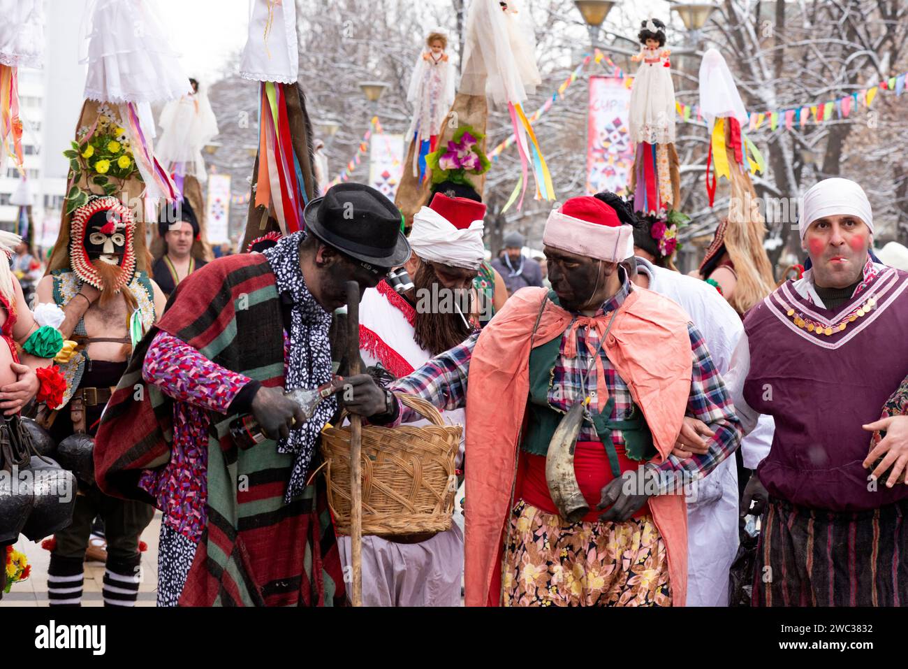 Masked participants with painted faces from Central Bulgaria at the Surva International Masquerade and Mummers Festival in Pernik, Sofia Region, Bulgaria, Eastern Europe, Balkans, EU Stock Photo