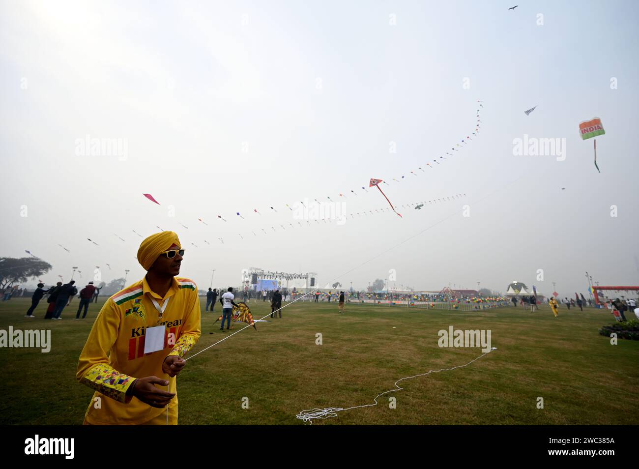 NEW DELHI, INDIA - JANUARY 13: People flying kites during the first ...