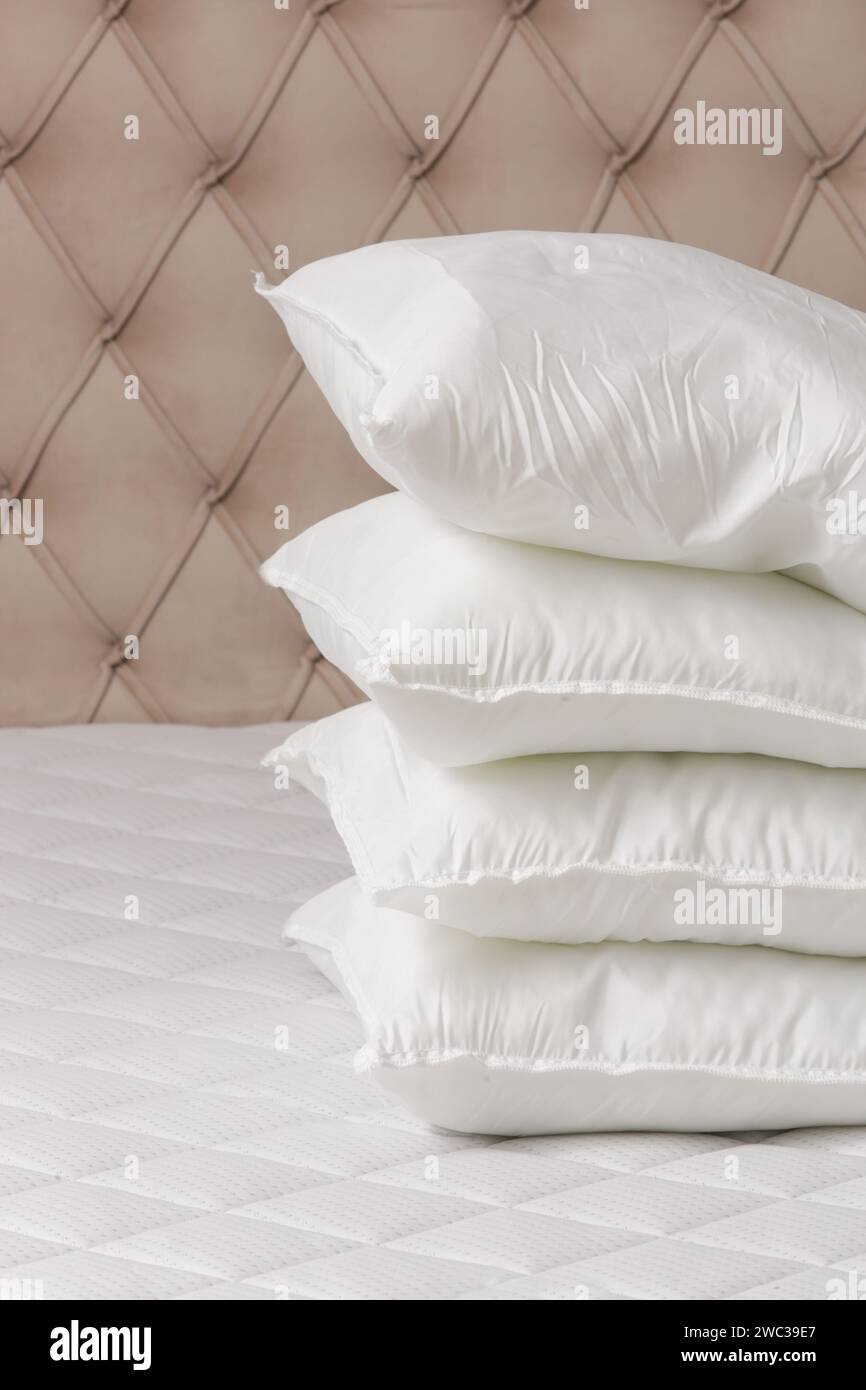 Soft comfortable white pillows on a bed Stock Photo