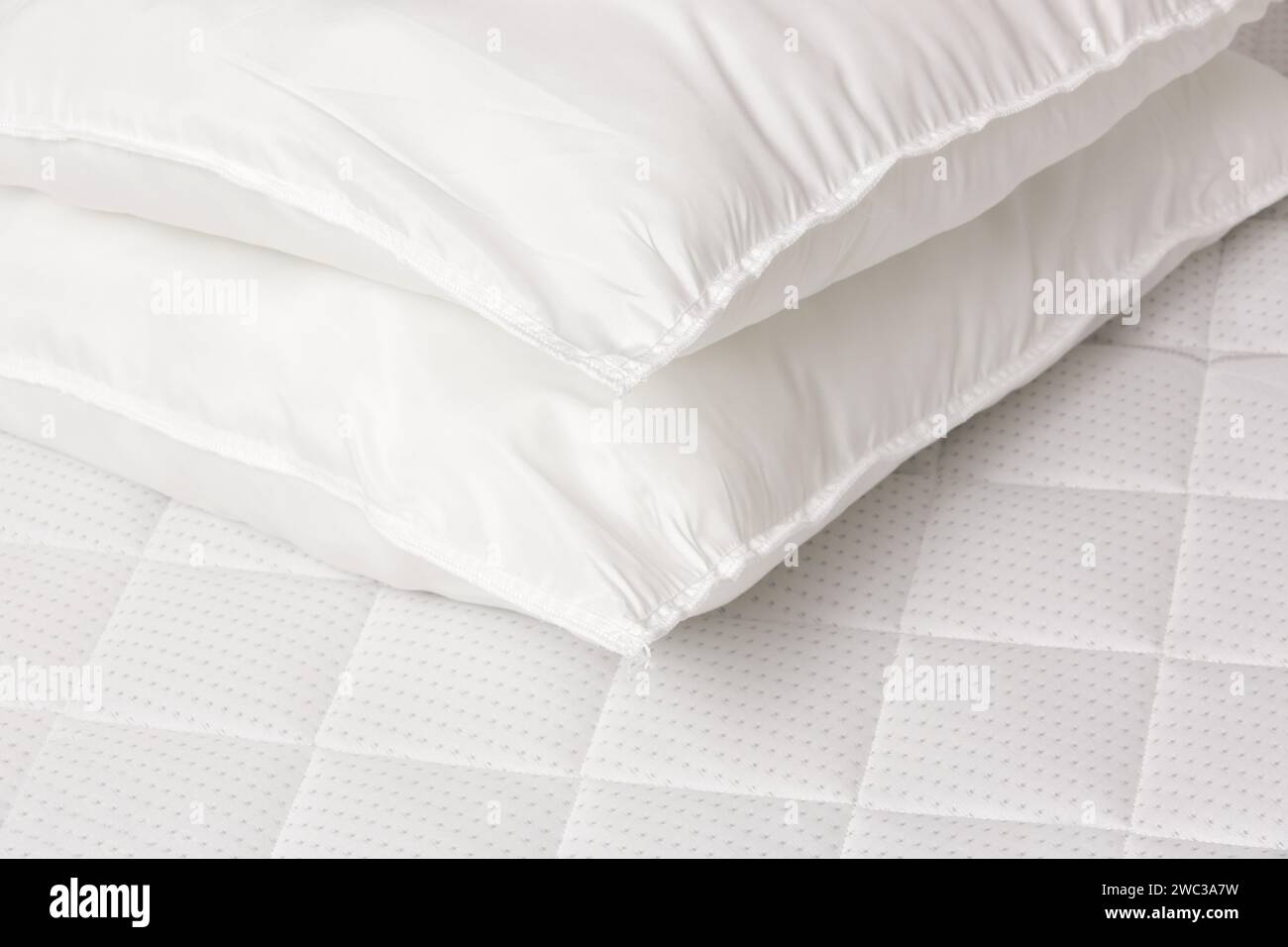 Soft comfortable white pillows on a bed Stock Photo