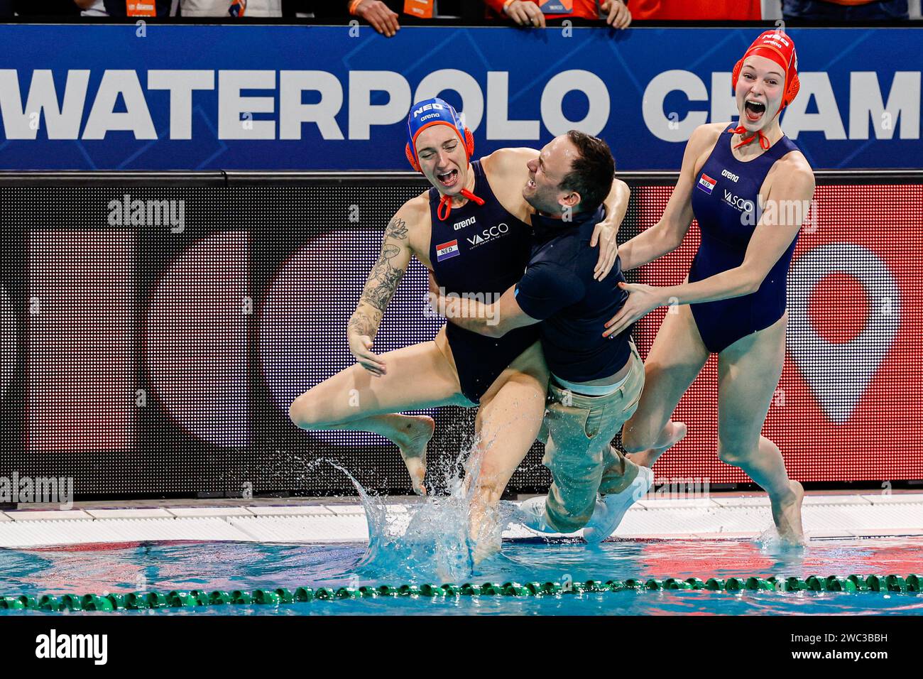 EINDHOVEN, NETHERLANDS - JANUARY 13: Sabrina van der Sloot of the Netherlands and Head Coach Evangelos Doudesis of the Netherlands Britt van den Dobbelsteen of the Netherlands jumping into the water celebrating victory competing in the Spain during Netherlands of the European Waterpolo Championships 2024 Final Women at Pieter van den Hoogeband Swimming Stadium on January 13, 2024 in Eindhoven, Netherlands . (Photo by /BSR Agency) Credit: BSR Agency/Alamy Live News Stock Photo
