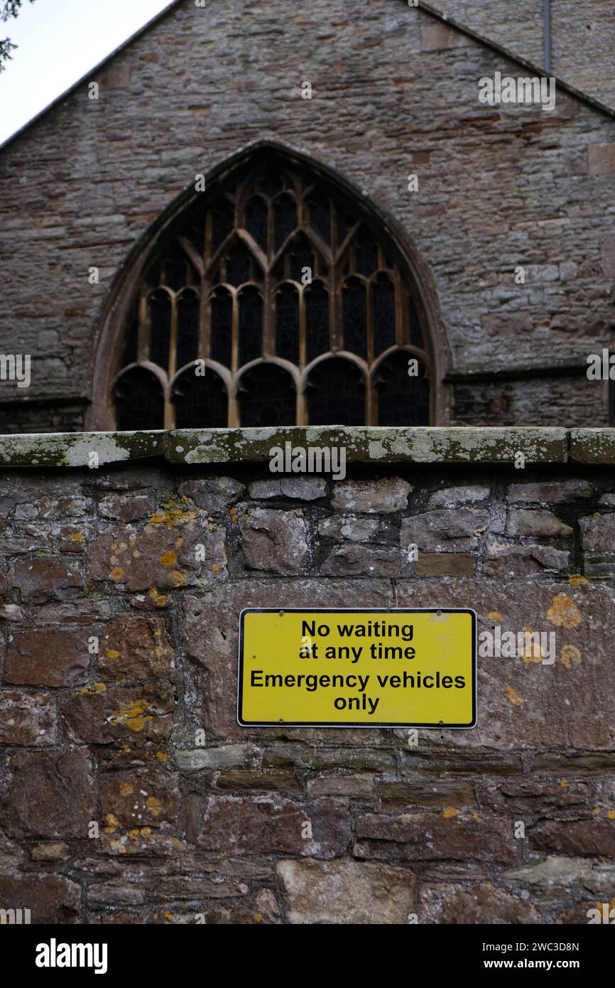 January 2024 - Sign on parking space reserved for emergency Vehicles beside St Mary's church in Yatton, North Somerset, England, UK. Stock Photo