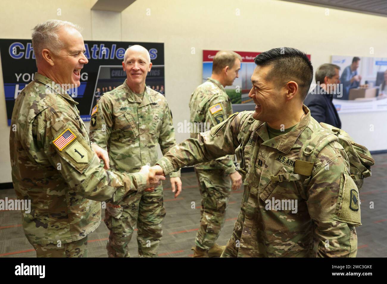 Capt. Marc Ueda, right, shakes hands with Gen. Gary Ropers at Omaha ...