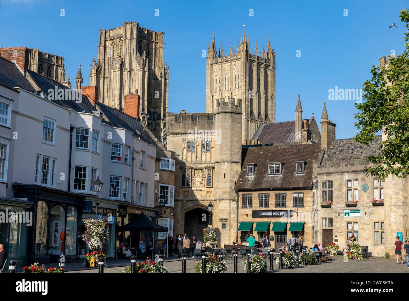 Wells Somerset city centre and Market Place hot autumn day people sitting at cafes and bars with friends, blue sky,England,UK,2023 Stock Photo
