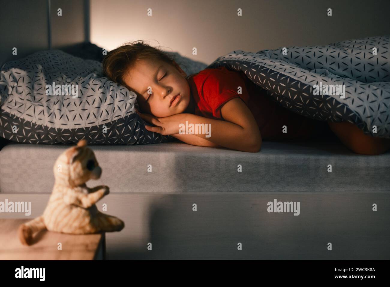 Child sleeping at night. Comfortable bed for kids. Toddler girl sleeping tight, fast falling