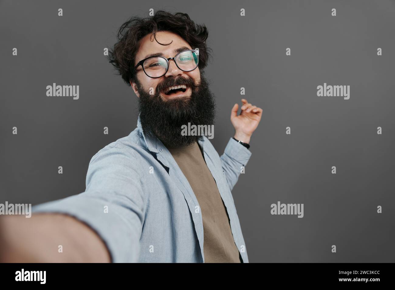 Bearded Man Taking a Selfie with a Joyful Expression Stock Photo - Alamy