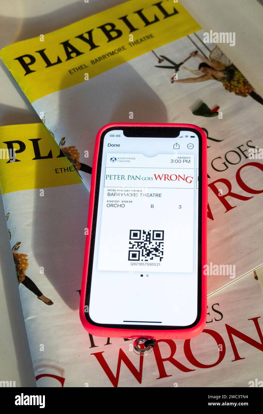 Playbills and Tickets on iPhone, Peter Pan Goes Wrong, 2023, NYC, USA Stock Photo