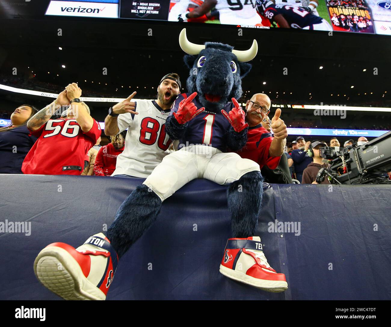 January 13, 2024: Houston Texans mascot Toro sits with fans during an NFL Wild Card playoff game between the Texans and the Cleveland Browns on January 13, 2024 in Houston. The Texans won, 45-14. (Credit Image: © Scott Coleman/ZUMA Press Wire) EDITORIAL USAGE ONLY! Not for Commercial USAGE! Stock Photo