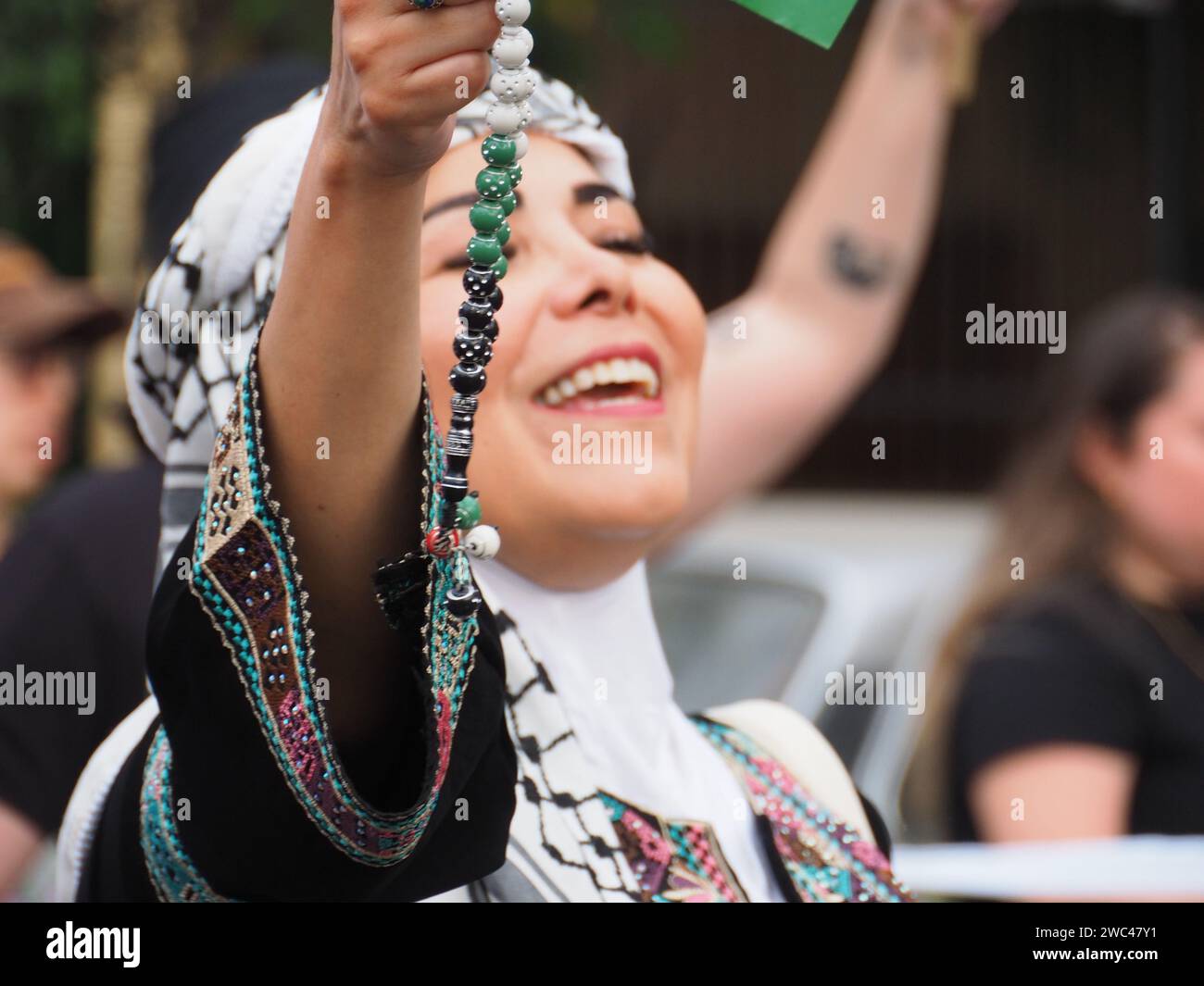 Lima, Peru. 13th Jan, 2024. A Misbaha, prayer beads, shown by a Islamic woman when dozens took to the streets in Lima to demonstrate as part of a Global March for Palestine. They are joining millions more who will be marching in more than 66 cities, in at least 36 countries, in a Global Day of Action for Palestine. Credit: Fotoholica Press Agency/Alamy Live News Stock Photo