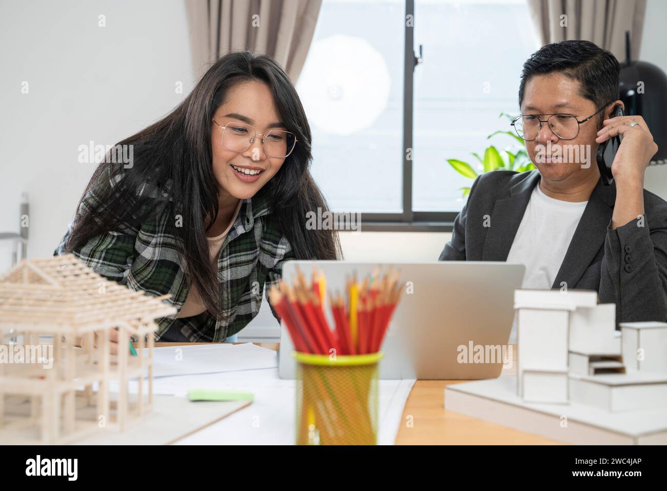 Architects women and engineer working on construction site. Stock Photo