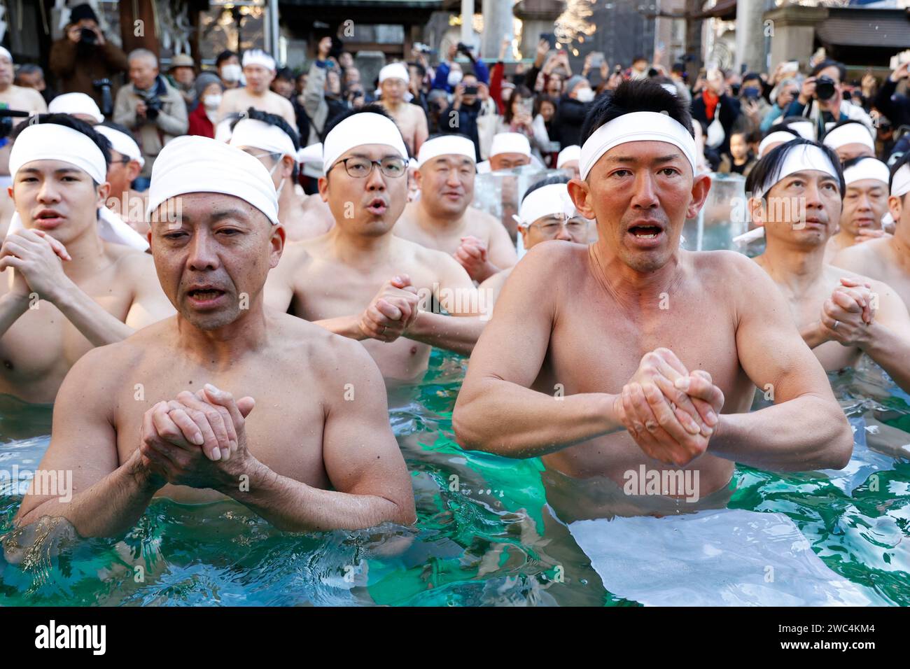 Tokyo, Japan. 14th Jan, 2024. Participants dressed only in loincloths