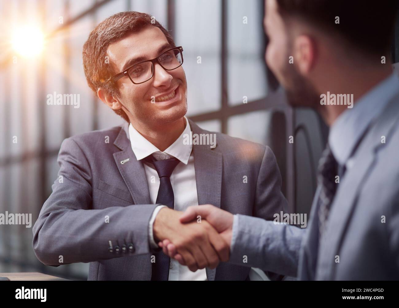 Two diverse business men analysts partners talking, working together Stock Photo
