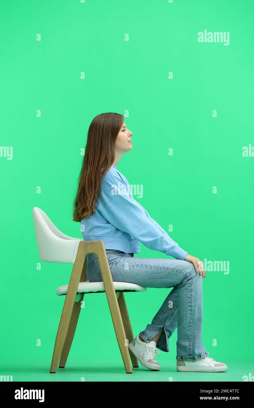 Woman sitting chair full length hi-res stock photography and images - Alamy