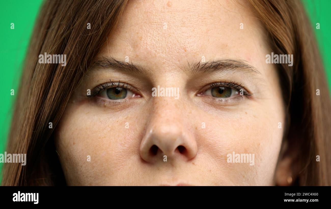 woman-s-face-close-up-on-a-green-background-stock-photo-alamy