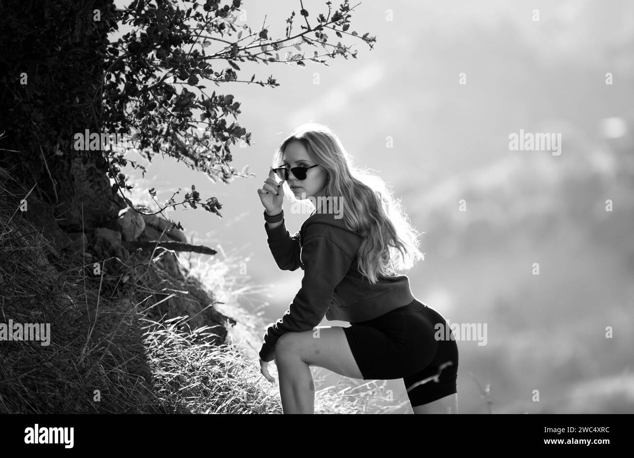 Woman traveler looking at Batur volcano. Indonesia. Female hiker with