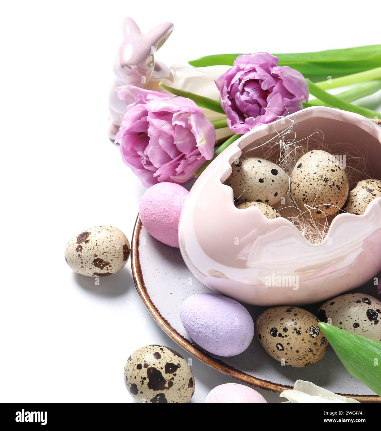 Tulip flowers and decorative shell with Easter quail eggs on white ...