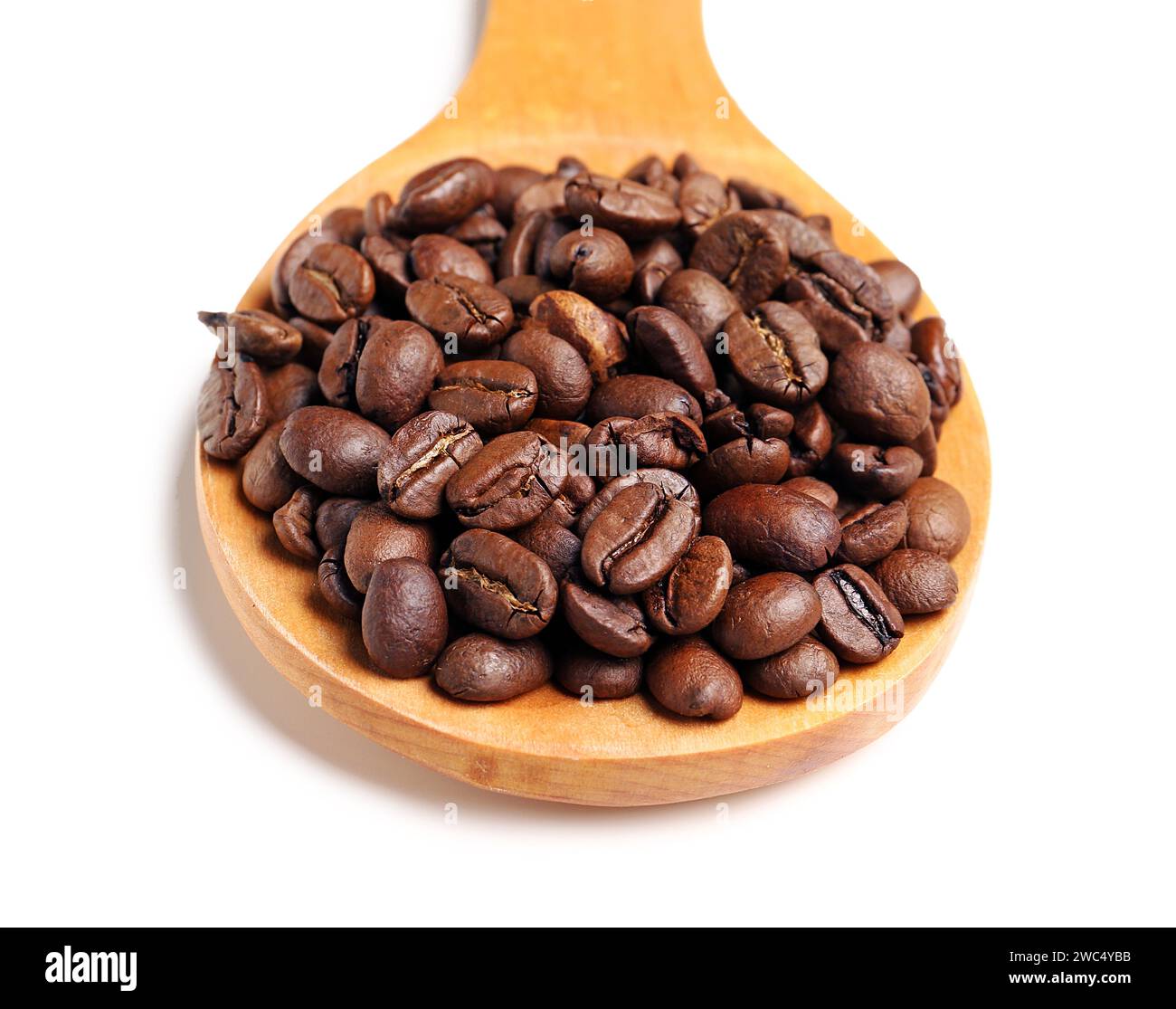 Wooden spoon with coffee beans isolated on white background Stock Photo ...