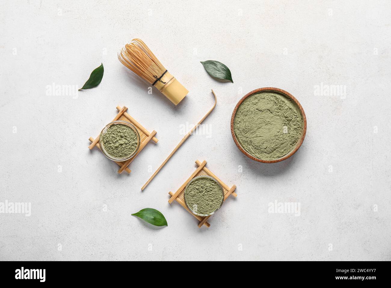Composition with powdered matcha tea and accessories on light background Stock Photo