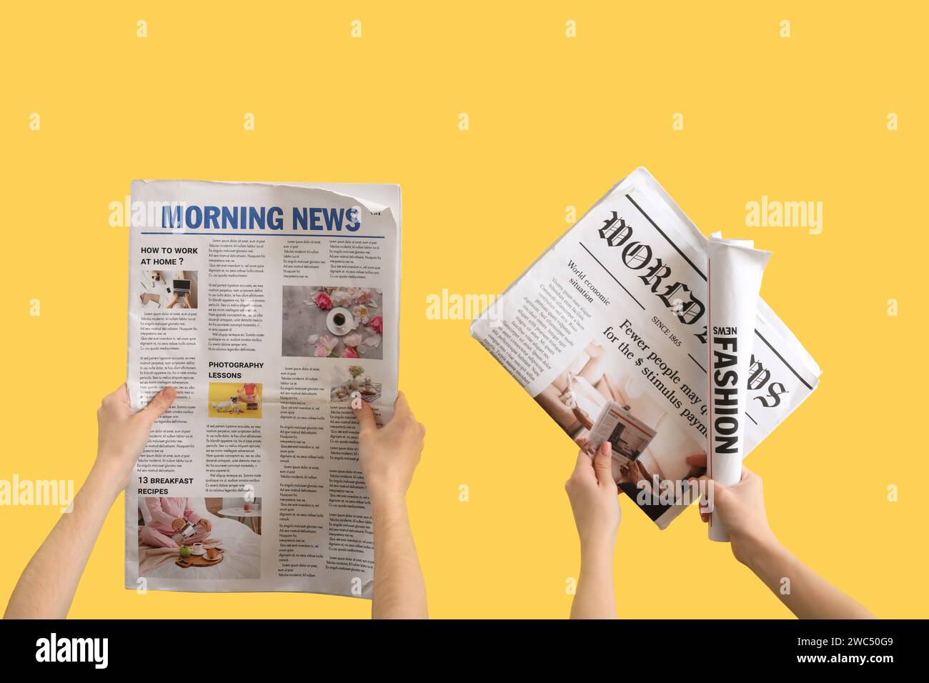 Women with newspapers on yellow background Stock Photo