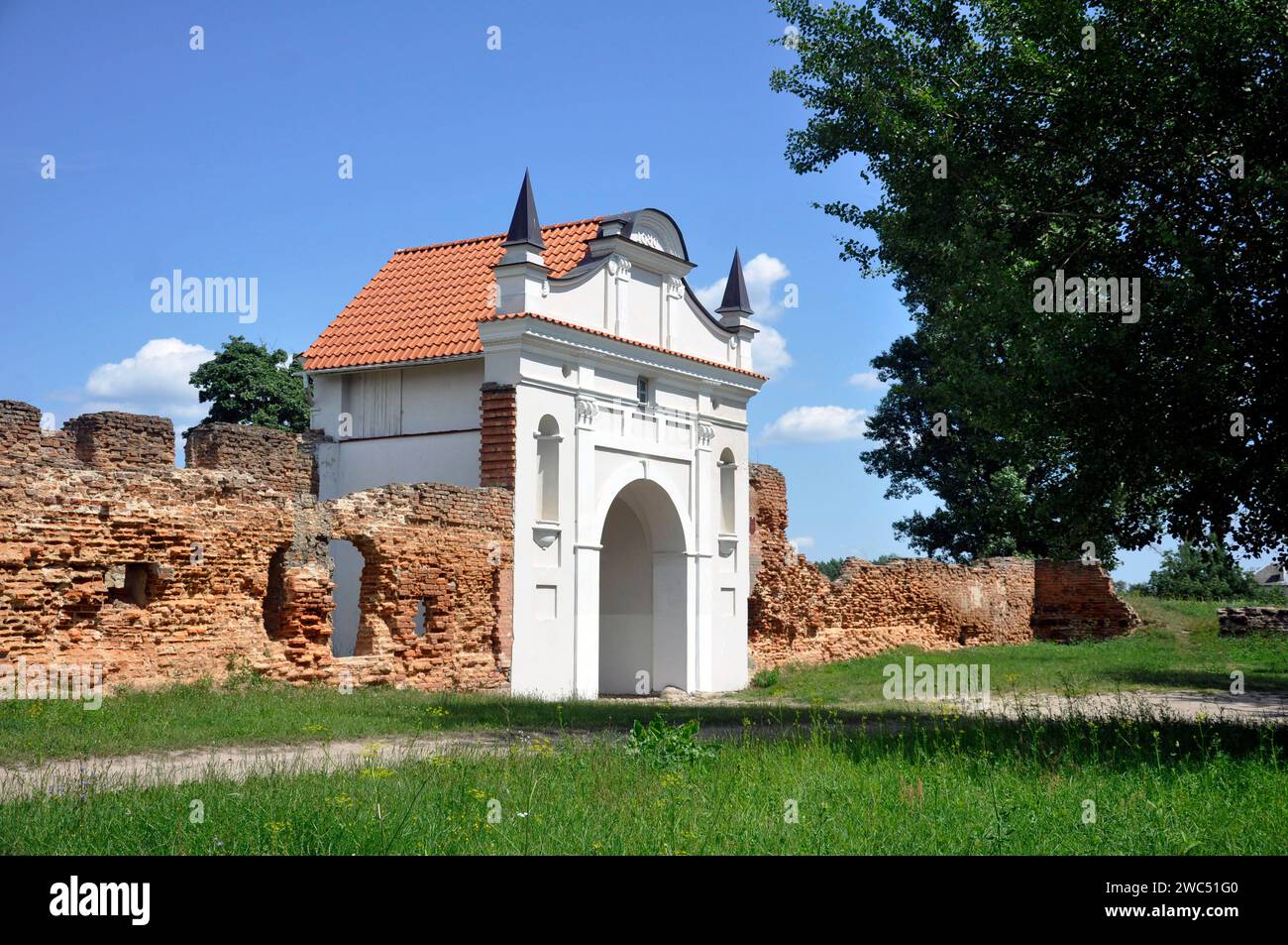 Restored entrance gate and remains of the walls of the Carthusian monastery of 1648-1666 in the town of Bereza, Belarus. Stock Photo