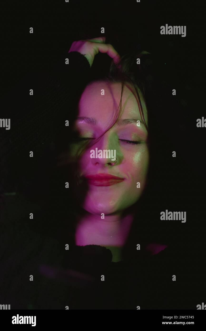 A captivating image featuring a serene woman with closed eyes