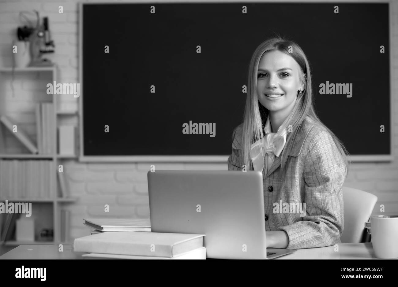 Focused student, young woman online watching webinar on laptop