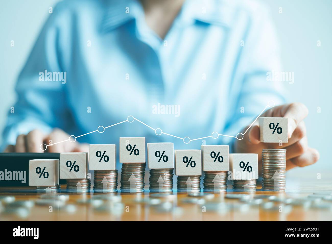 Interest rate and dividend concept, Hand putting wood cube block ...