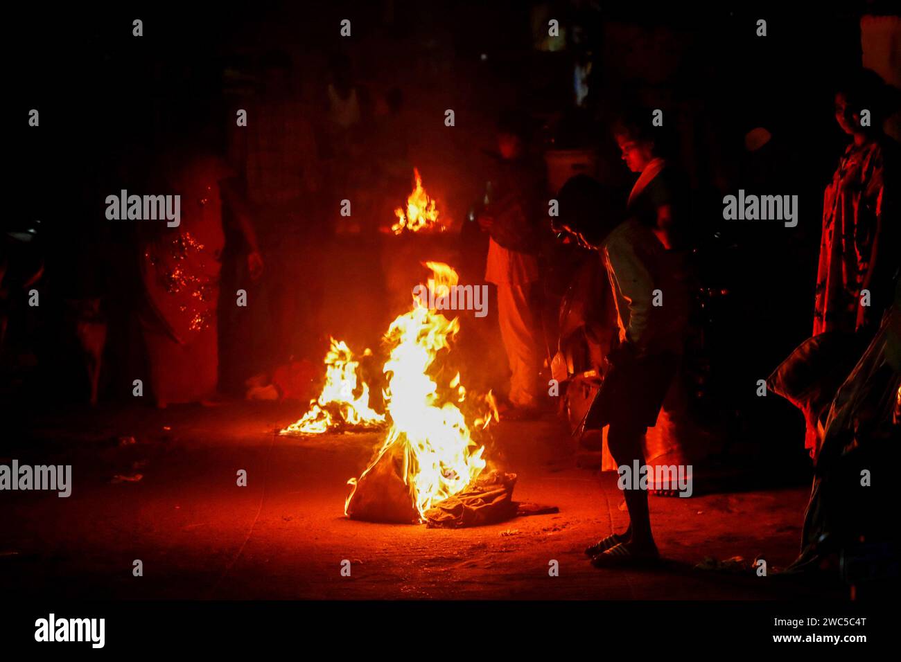 Chennai, India. 14th Jan, 2024. Bhogi Pandigai (festival) is celebrated widely in Tamil Nadu, Andhra Pradesh, Telangana, Karnataka, and Maharashtra. in the Southern states of India as the first day of the four-day harvest festival of Pongal. It is the day of discarding everything that is old and thus bringing new fortune and prosperity into people's lives. On the day of Bhogi Pandigai, people get up early in the morning, usually before dawn and light a bonfire known as ‘Bhogi Mantalu' with wood and other solid fuels. Credit: Seshadri SUKUMAR/Alamy Live News Stock Photo