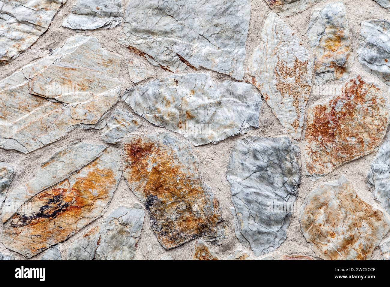 Close up of old weathered stone wall for background Stock Photo - Alamy