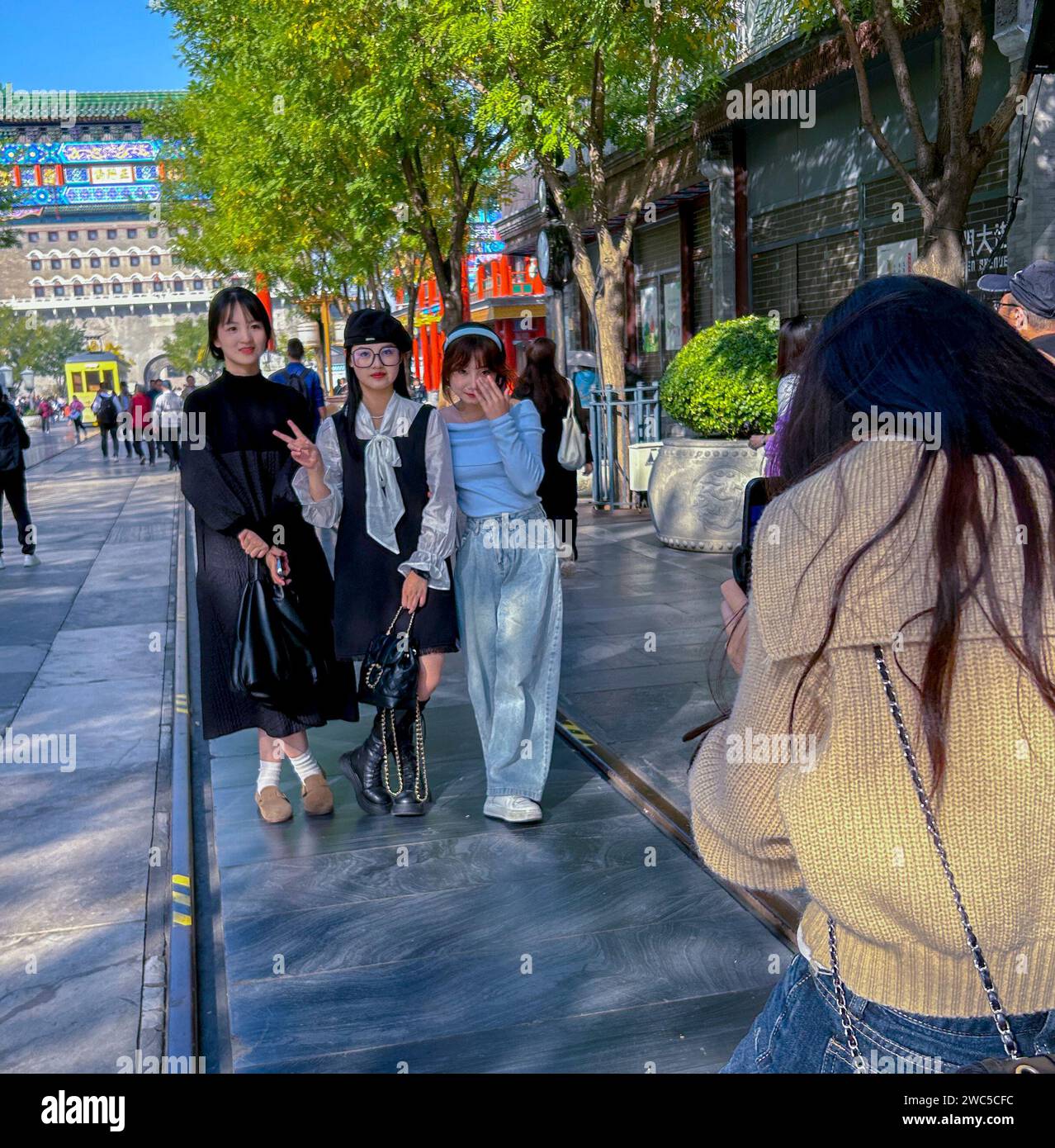 Beijing, China, Group Chinese Teens Girls, Posing for Photos, Tourists Visiting in Traditional Neighborhood , Qianmen neighborhood, full body Stock Photo