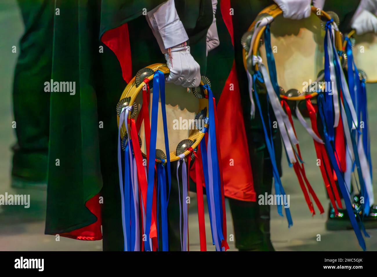 The tambourine is a fundamental instrument of the rondallas, popular musical performances with parades and flag bearers. Stock Photo