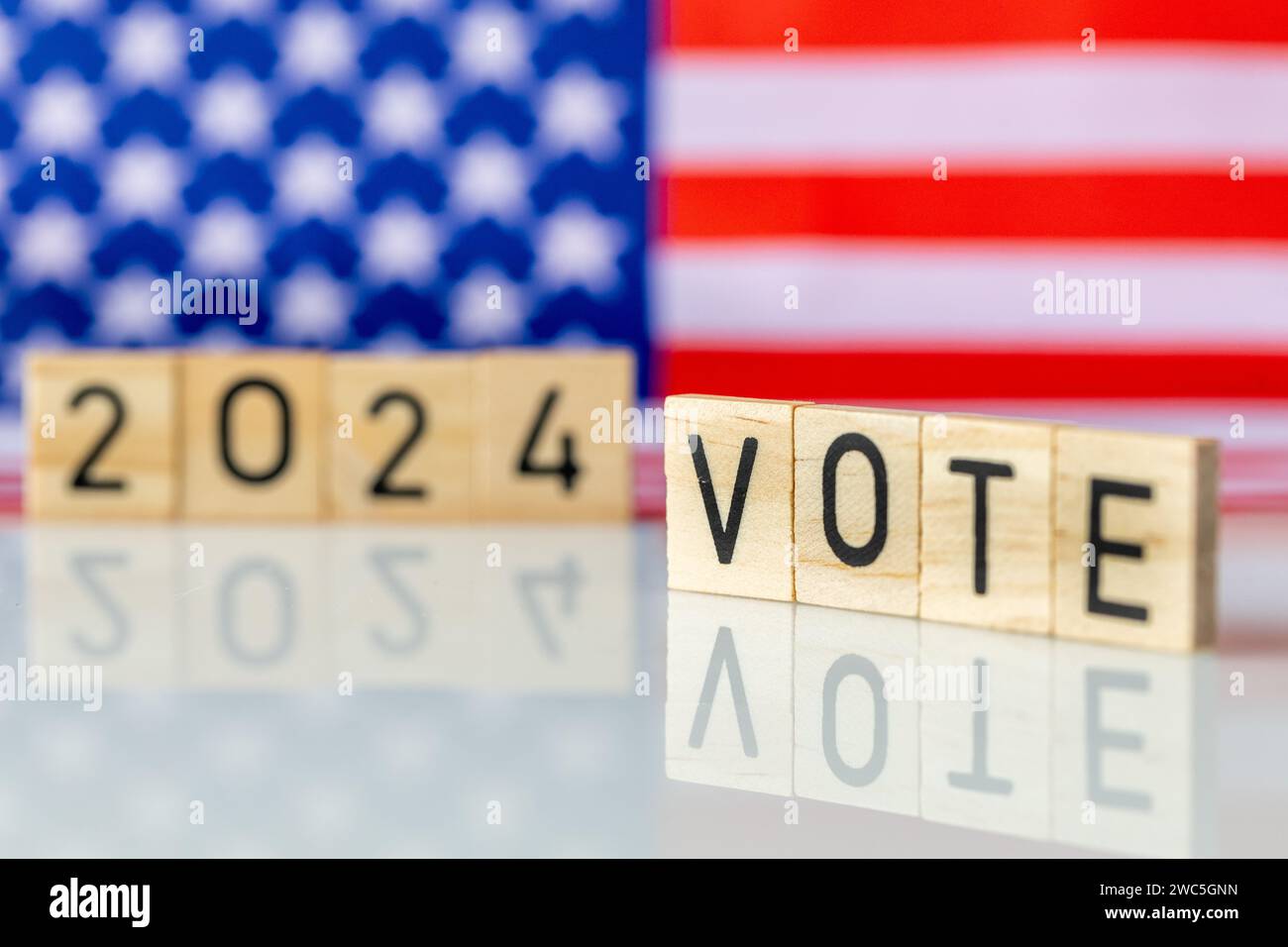 US elections 2024, American flag and the inscription VOTE 2024. The concept of voting in the United States in 2024. Stock Photo