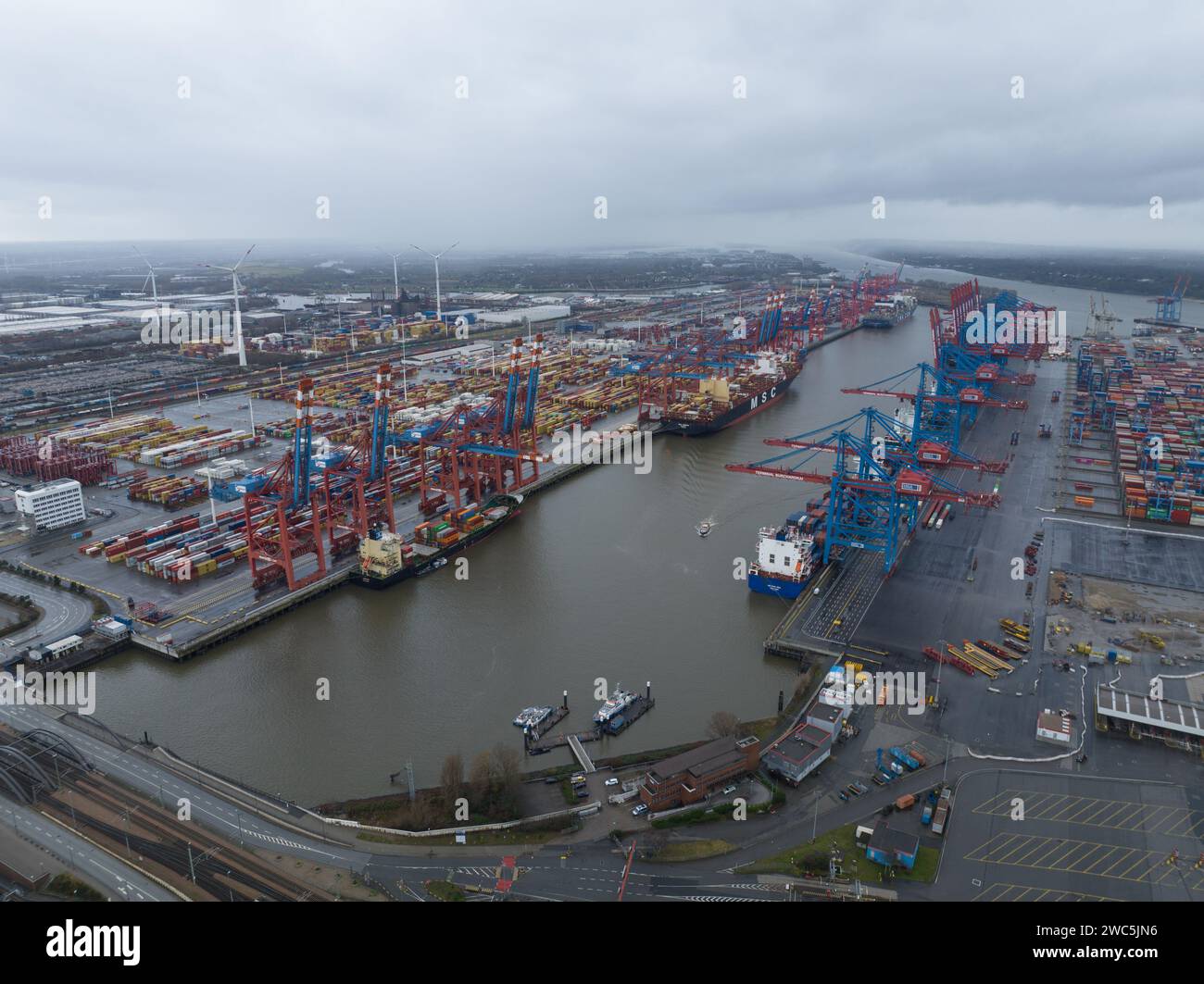 Hamburg, Germany, December 30th, 2023: Hamburg container terminal. Seaport on the river Elbe in Hamburg, Germany, 110 kilometresfrom its mouth on the Stock Photo