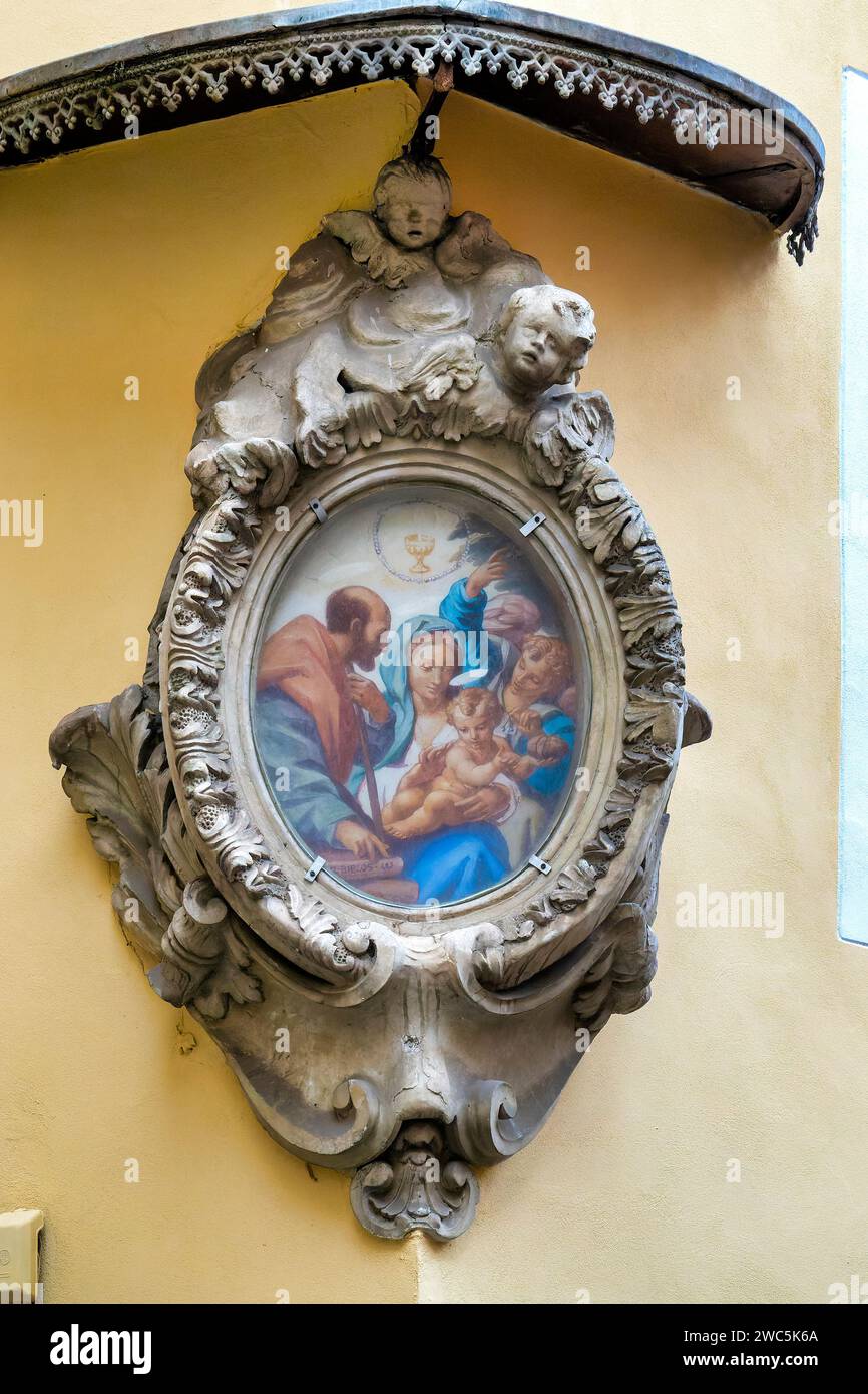 Madonna col Bambino and San Filippo Neri aedicula in Via di Panico corner Vicolo di San Celso, Rome, Italy Stock Photo