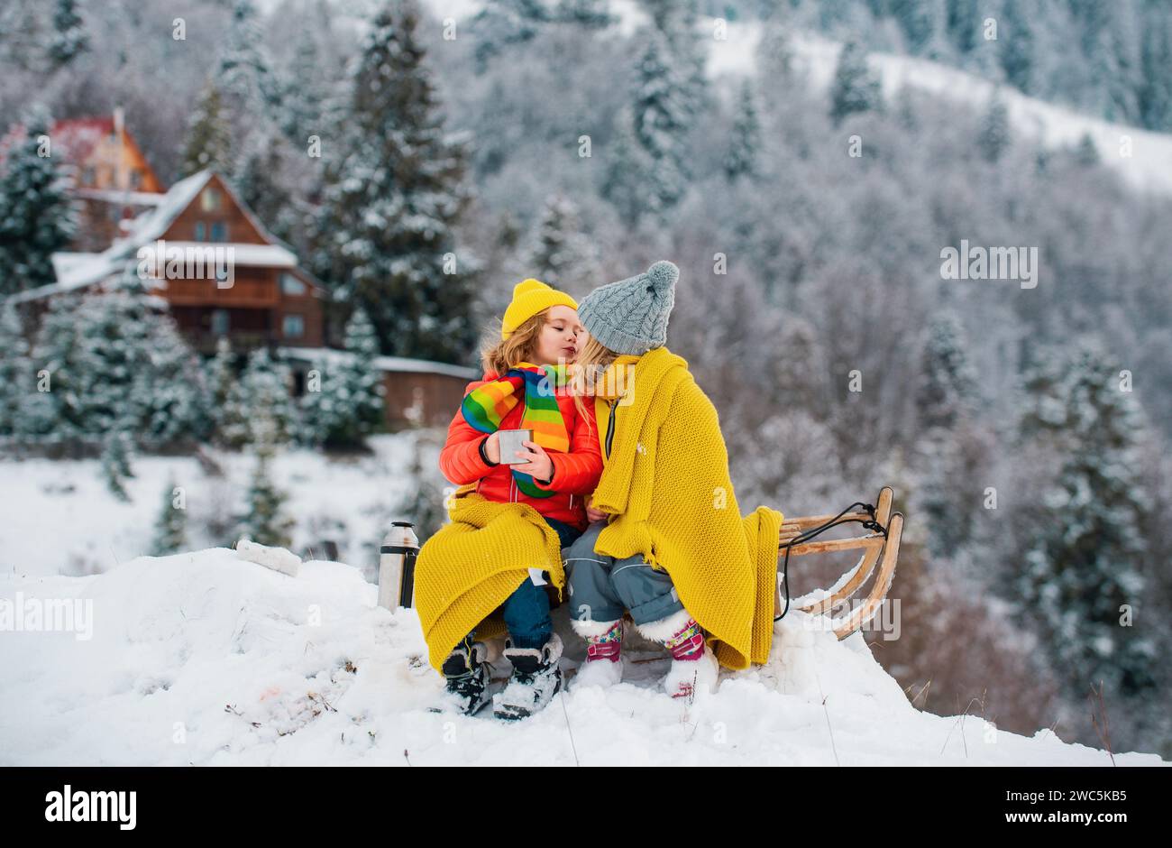 Sled Riding Images Happy little boy and girl sledding in winter. Kids sibling riding on ...