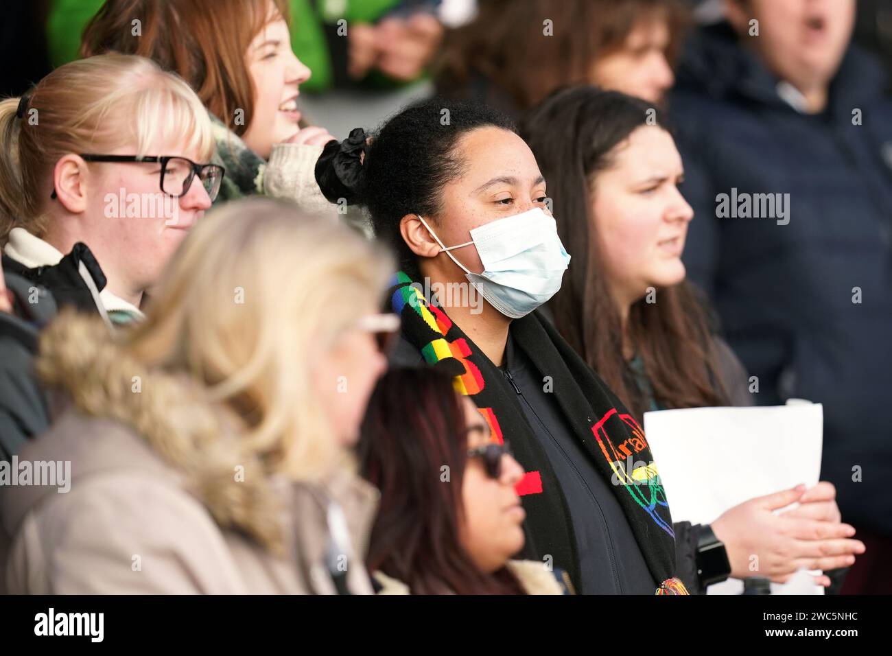 An Arsenal fan wearing a face mask in the stands ahead of the Adobe ...