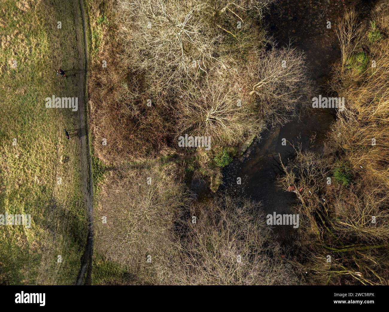 Bolton, England, UK, Sunday Januarey 14, 2024. Drone images of people enjoying a sunny cold start to the day by the River Croal in Leverhulme Park, Bolton. Credit: Paul Heyes/Alamy Live News Stock Photo