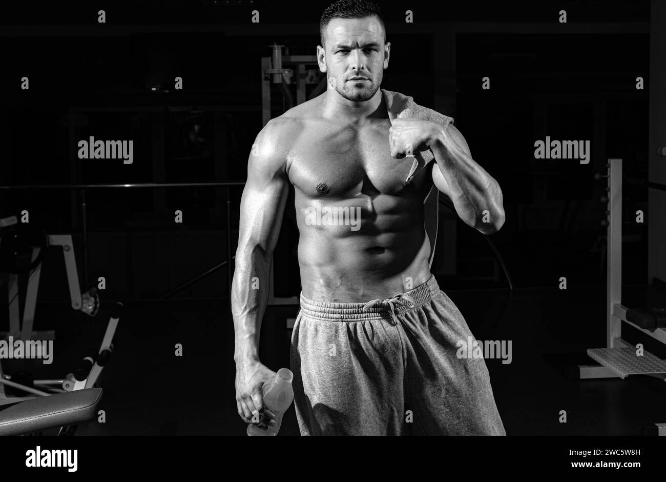 Sport health. Stay hydrated concept. Weightlifter gym man preparing for